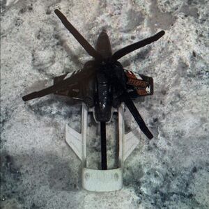 Black and White Toy Helicopter with Orange Accents